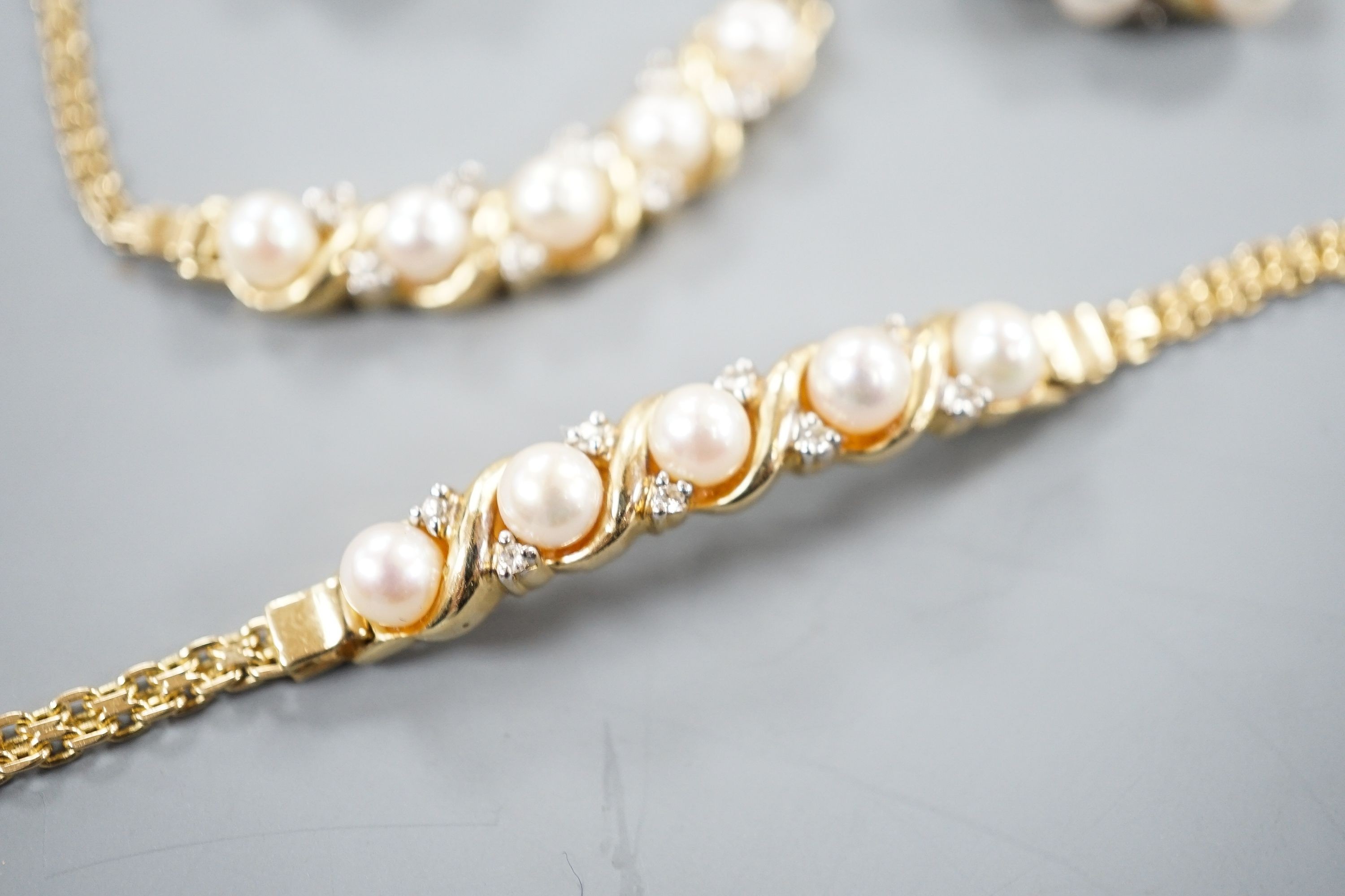 A modern matching suite of 14k yellow metal, cultured pearl and diamond chip set jewellery